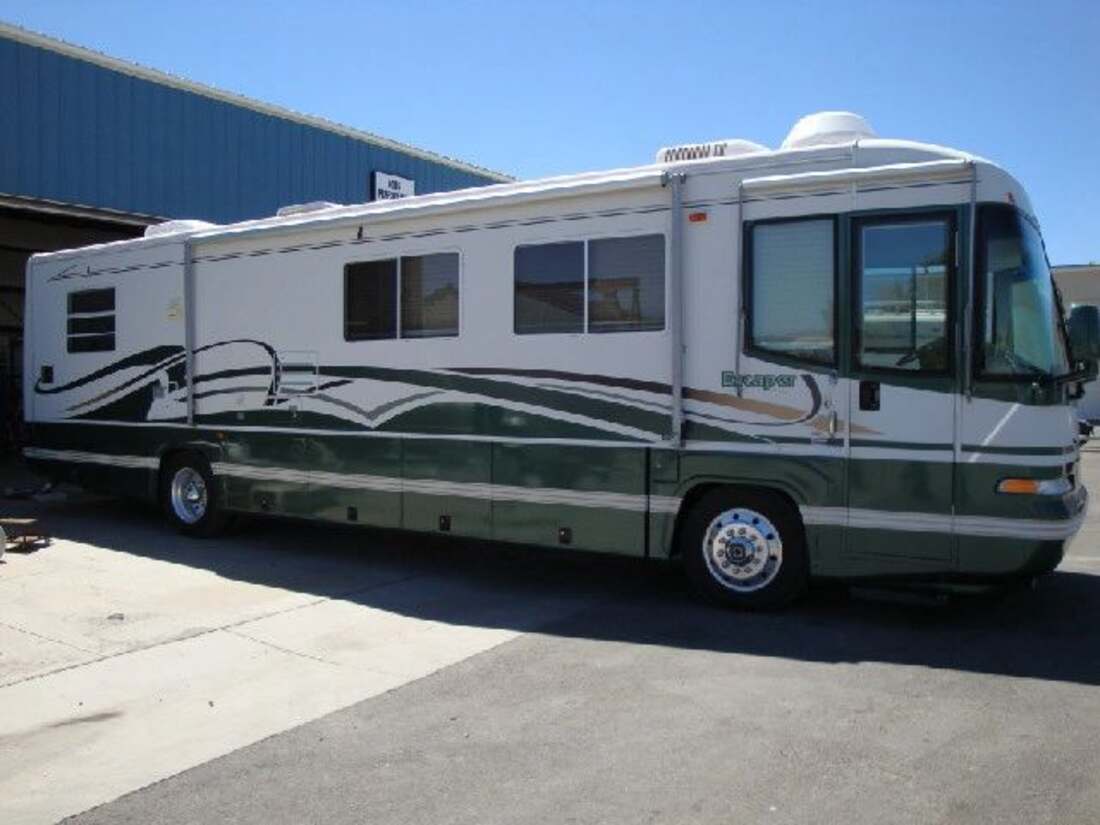 A Class A motorhome with dual rear wheels, the size of coach this page is about