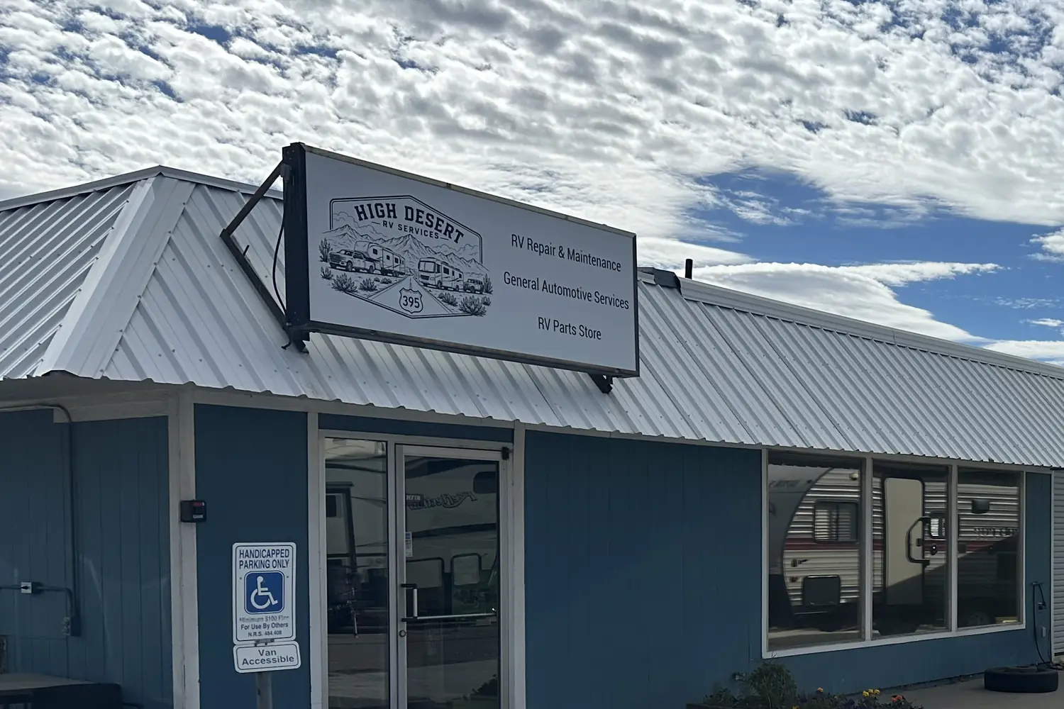 The High Desert RV Services building on Industrial Way in Gardnerville, under a sign reading RV repair and maintenance, general automotive services, and RV parts store